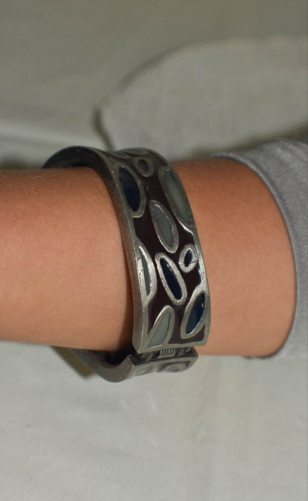Metal Bangle with Oval Motifs