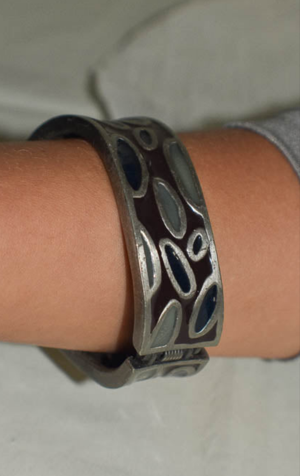 Metal Bangle with Oval Motifs