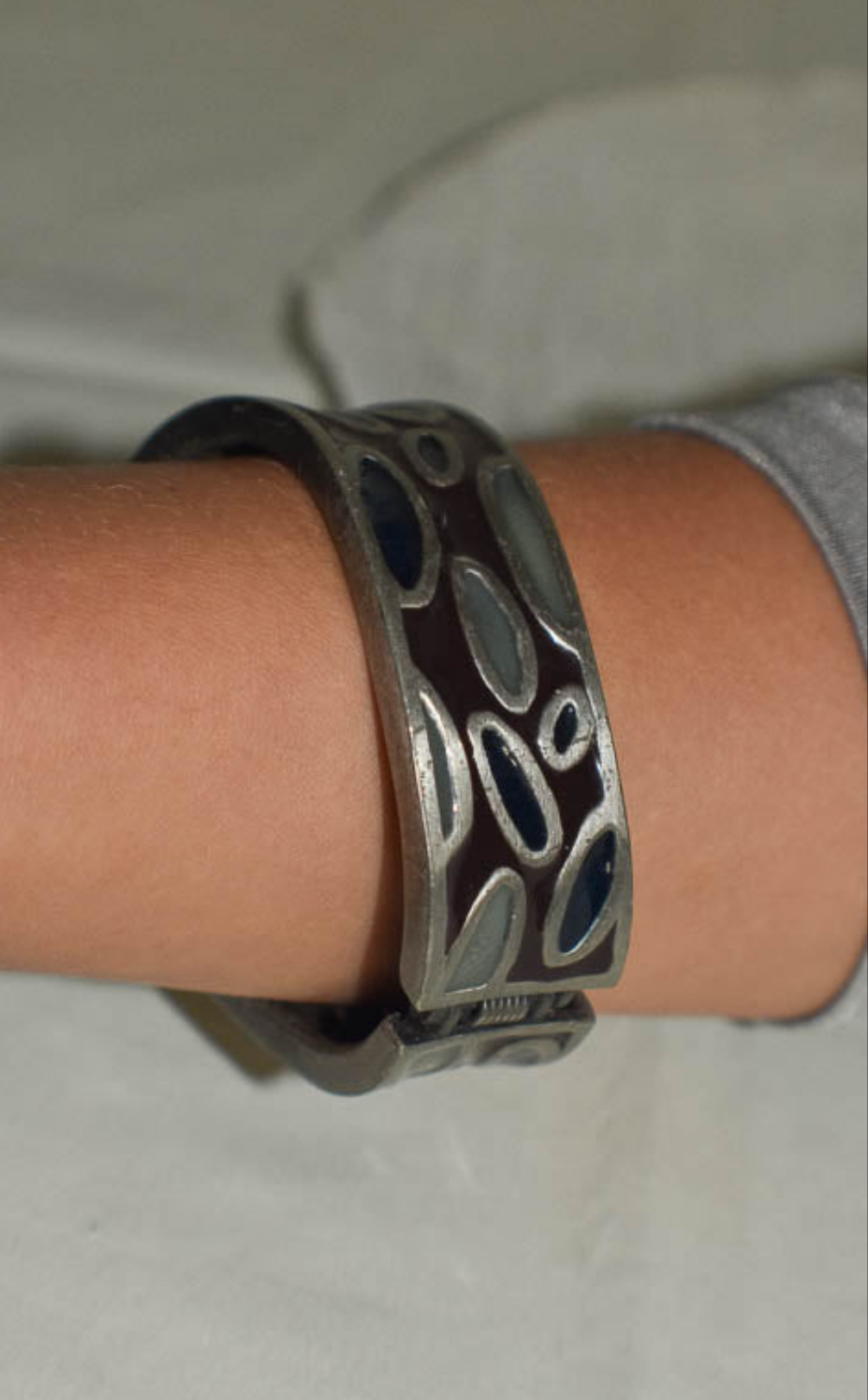 Metal Bangle with Oval Motifs