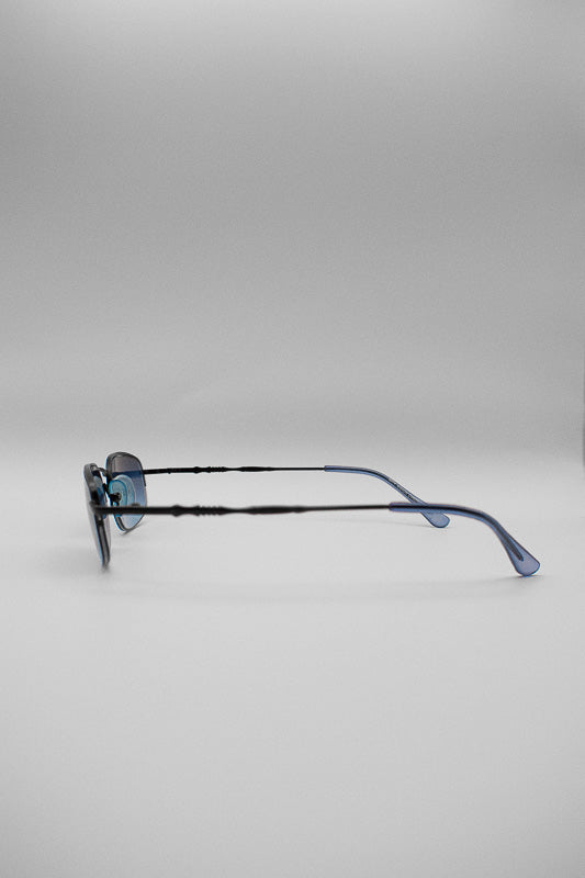 A pair of vintage blue tinted sunglasses with a black frame and arms, featuring a blue ombre tinted lens.