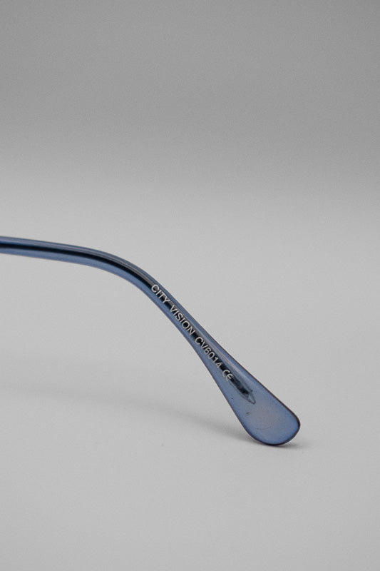 A pair of vintage blue tinted sunglasses with blue temple tips