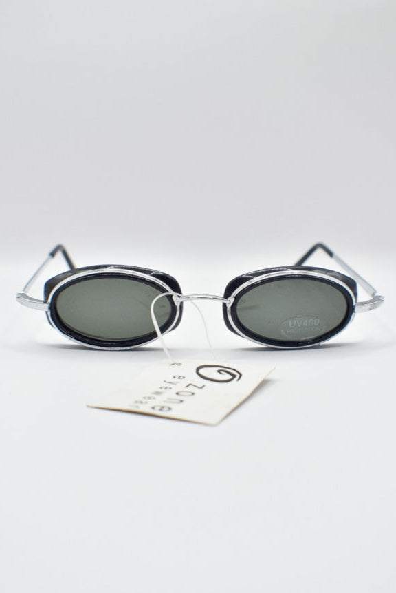 Sunglasses with a brand tag on a light gray background
