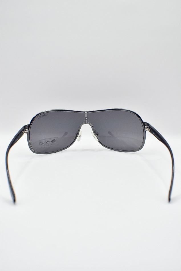 Sunglasses with black frame and gray lenses on a white background